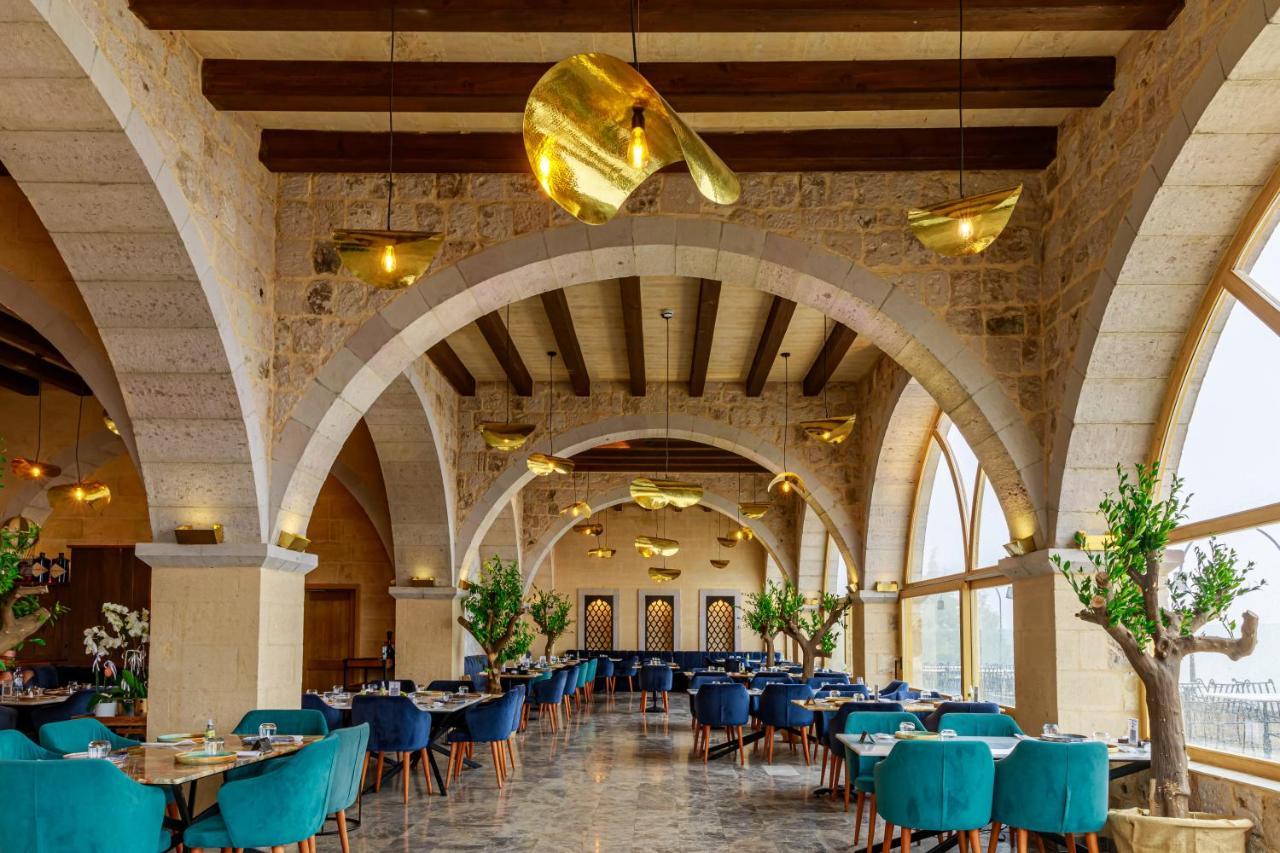 Millstone Cave Suites Hotel Üchisar Bagian luar foto